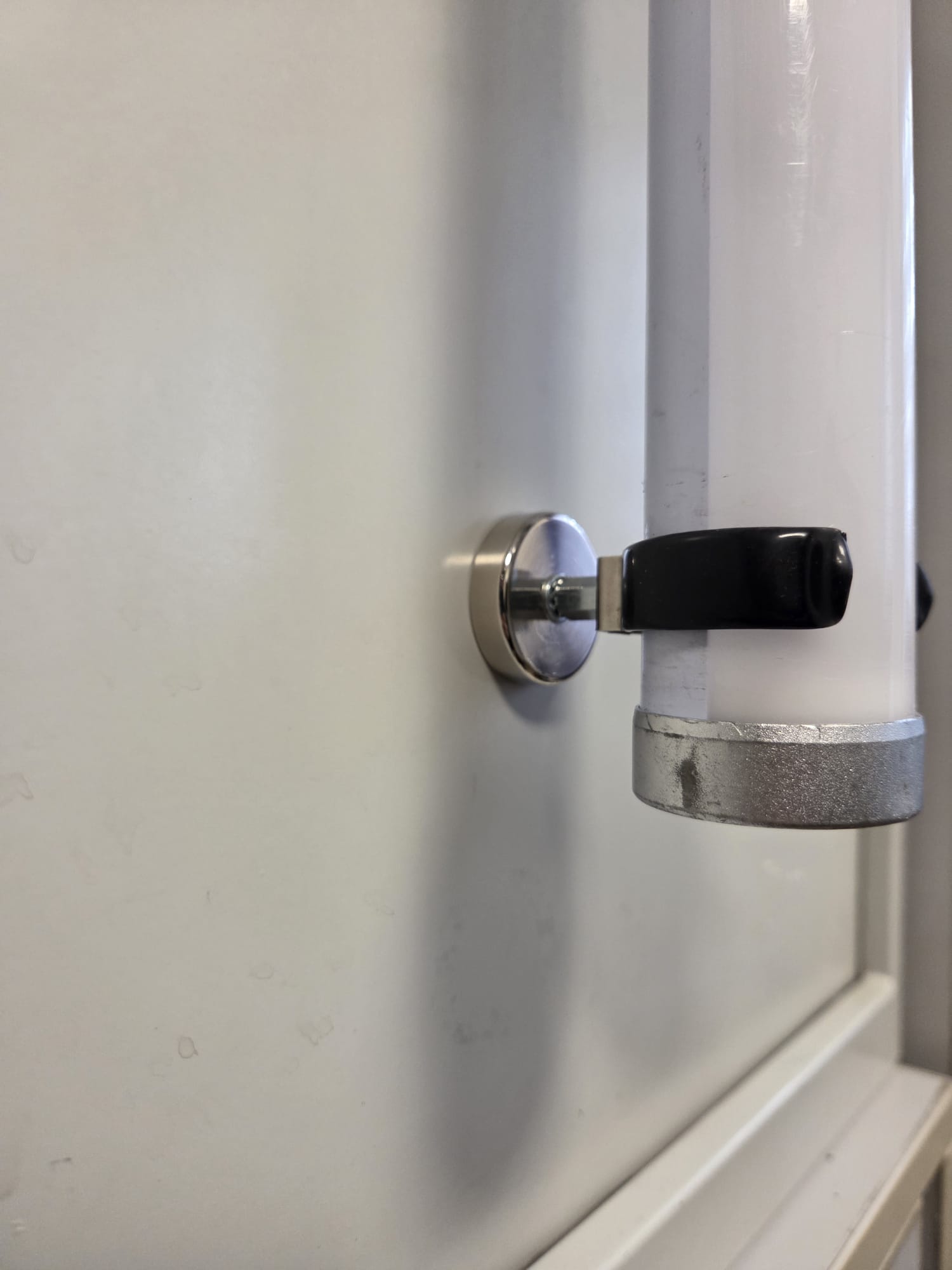 close up of magnetic clamp for tube light mounting